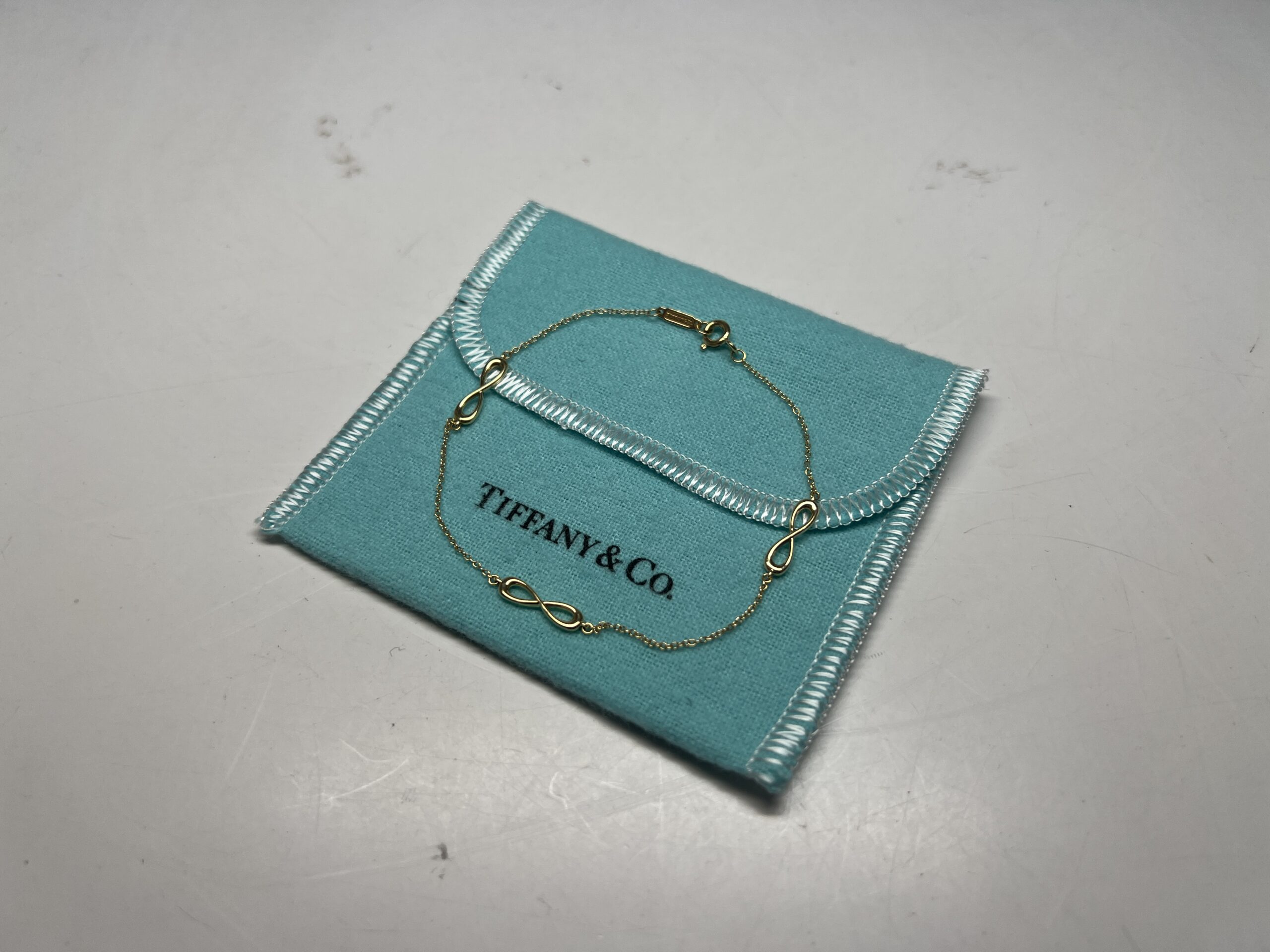 買取】ティファニー インフィニティ エンドレス ブレスレット 750 YG
