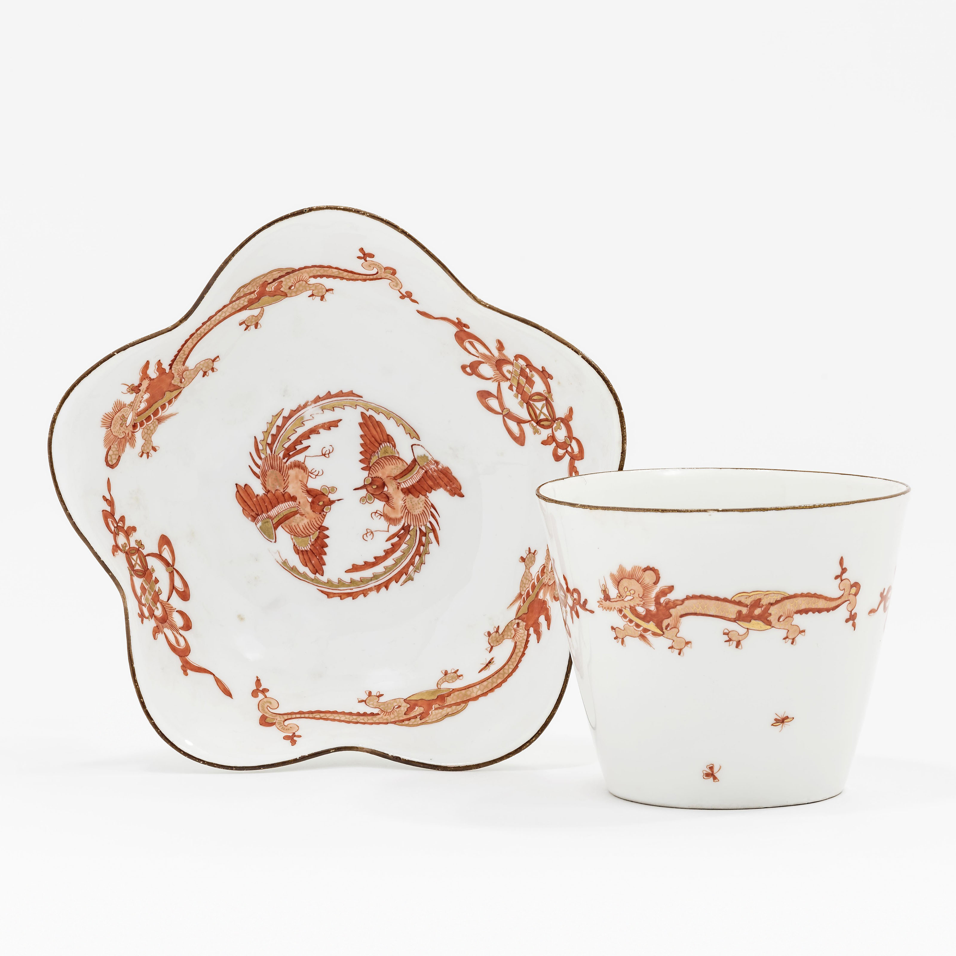 A MEISSEN PORCELAIN RED DRAGON PATTERN BEAKER AND A SHAPED SAUCER