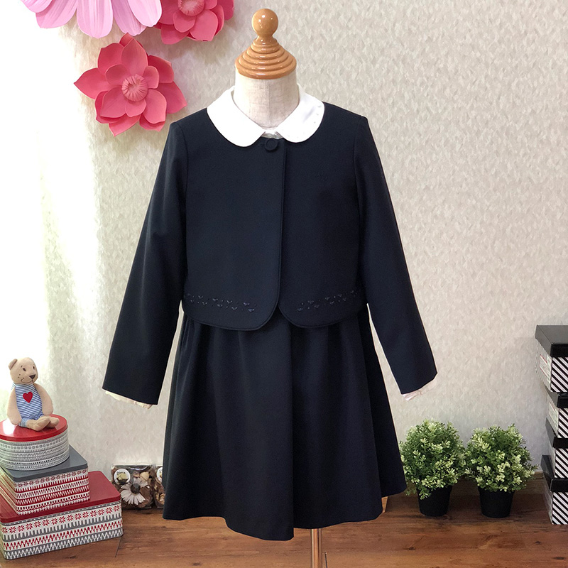 ポンポネット クラシカルな紺色ボレロとワンピースのアンサンブル