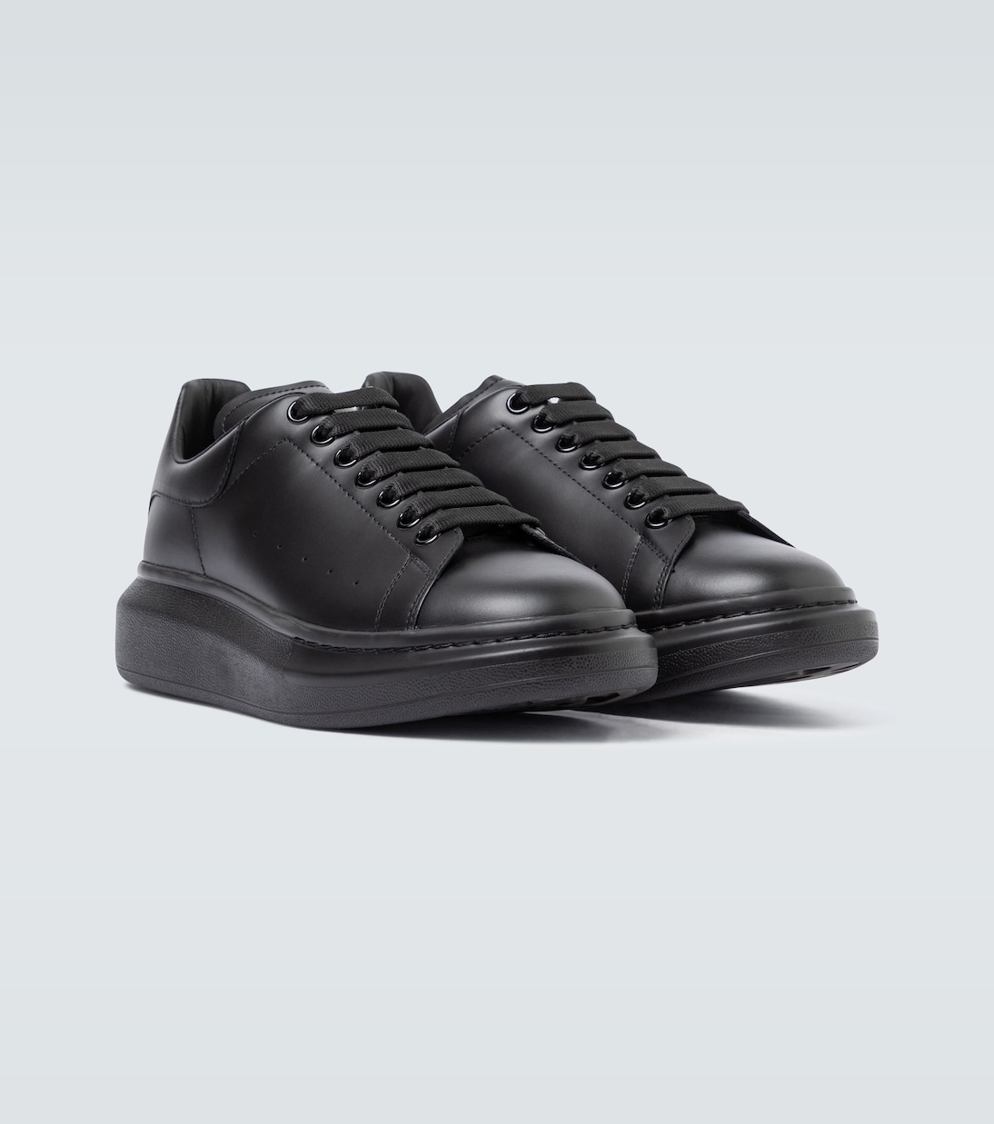 Oversized leather sneakers in black - Mc Queen | Mytheresa