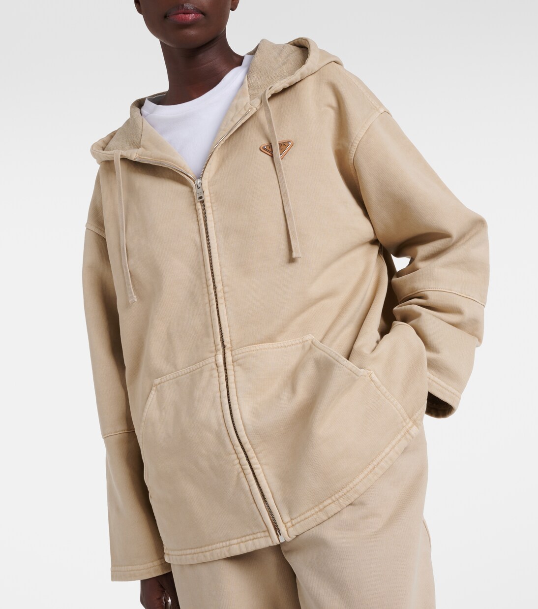 Oversized cotton zip-up hoodie in beige - Prada | Mytheresa