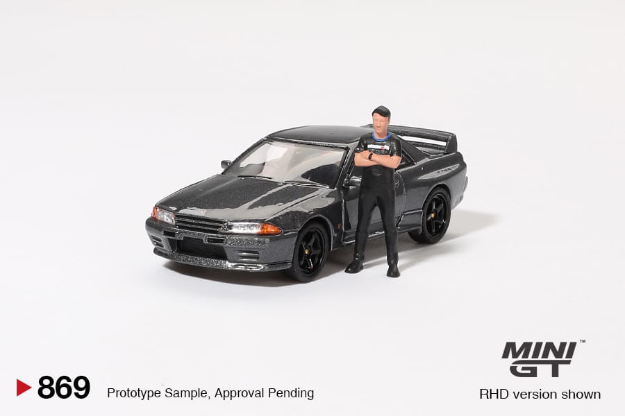 Mini GT 869 Nissan Skyline GT-R (R32) Gunmetal W/ Matsuda Figure