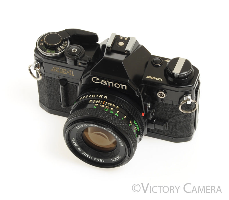 Canon AE-1 35mm Black Film Camera with 50mm f1.8 Lens -New Seals- [EXC
