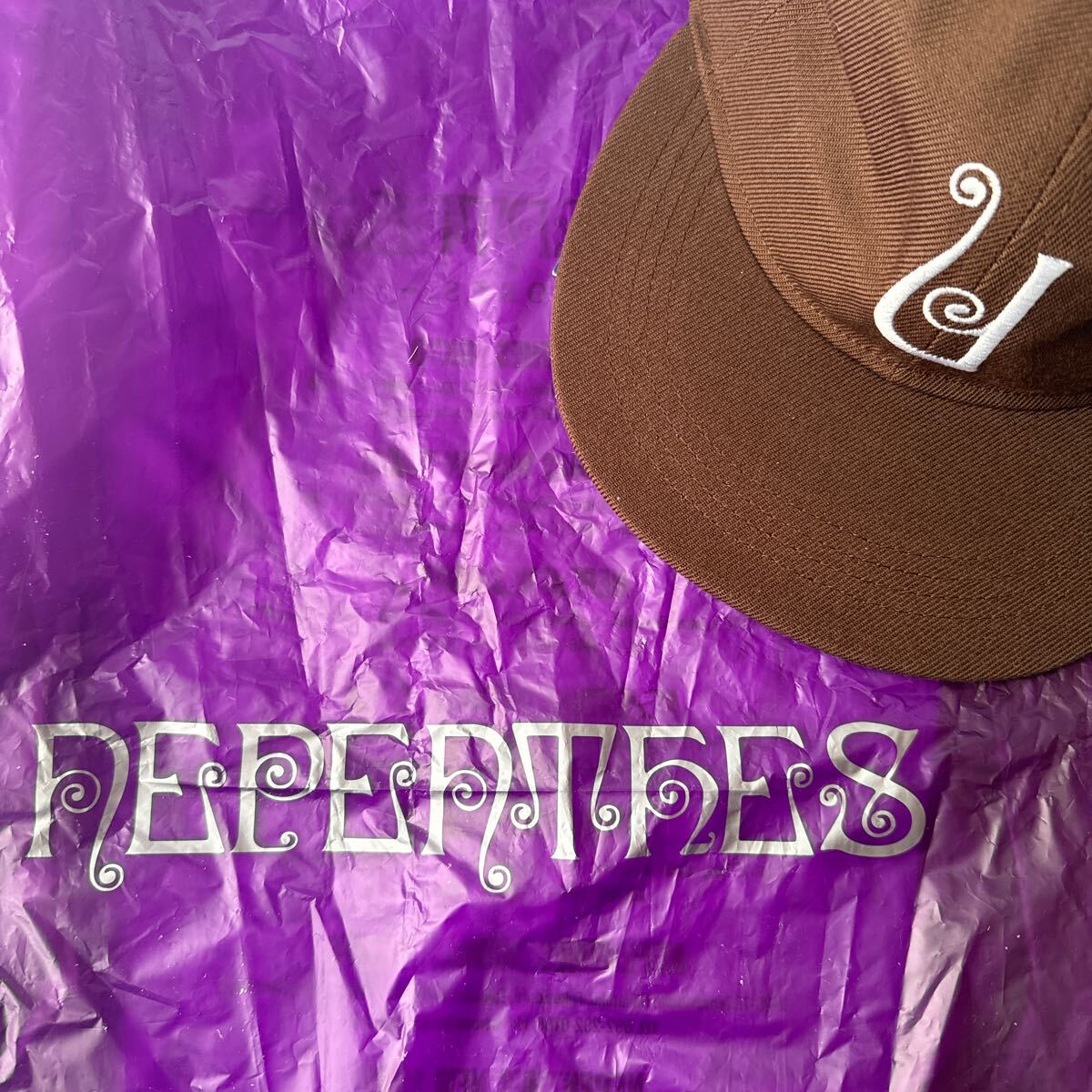 即完売 Unlikely×NEPENTHES NEW YORK CAP ブラウン アンライクリー