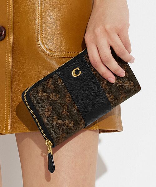 COACH（コーチ）の「アコーディオン ジップ ウォレット・ホース アンド