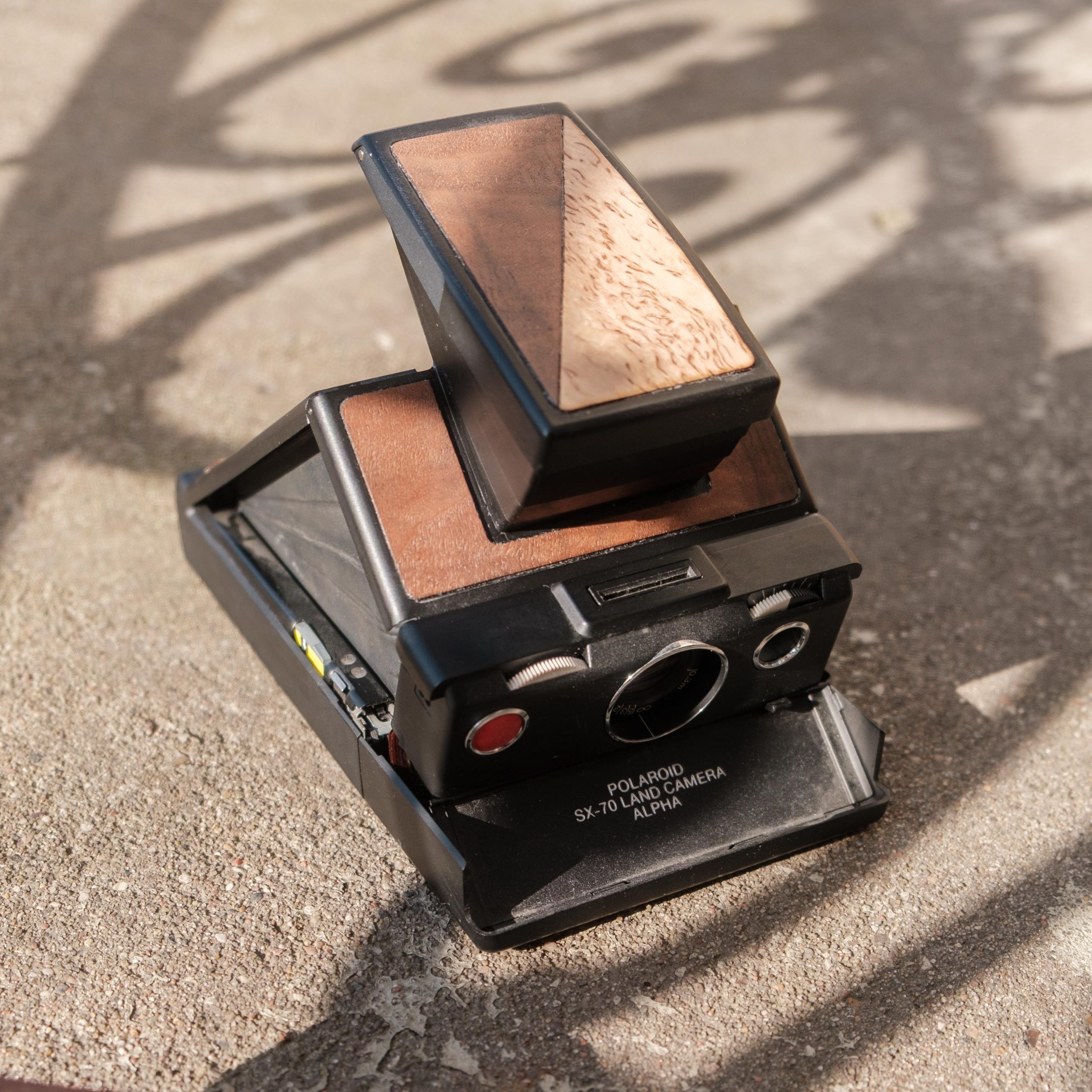 Polaroid SX-70 with mixed veneer inlay | Dora Goodman Cameras
