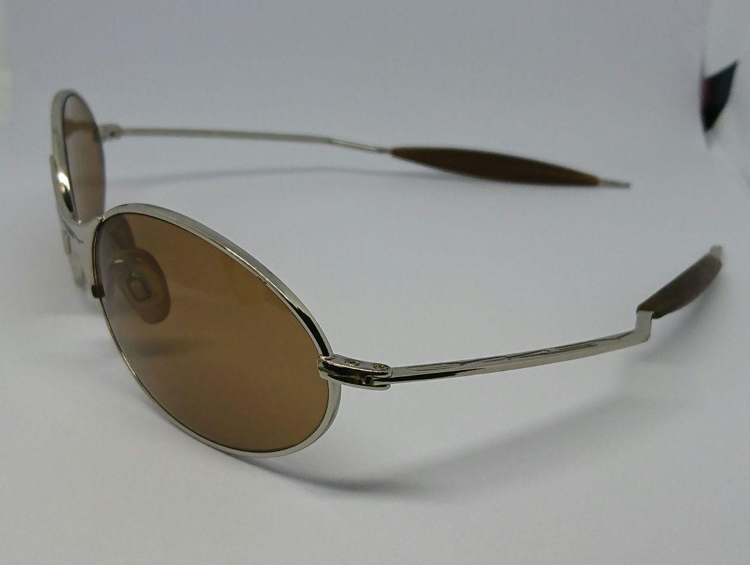 OAKLEY e-wire ['90s] Color: Gold (frame) x Brown (lens