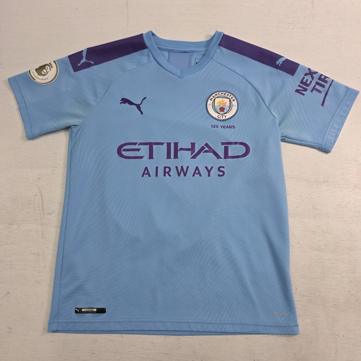 PUMA Men's Manchester City FC Home Authentic Jersey 125 Years Blue