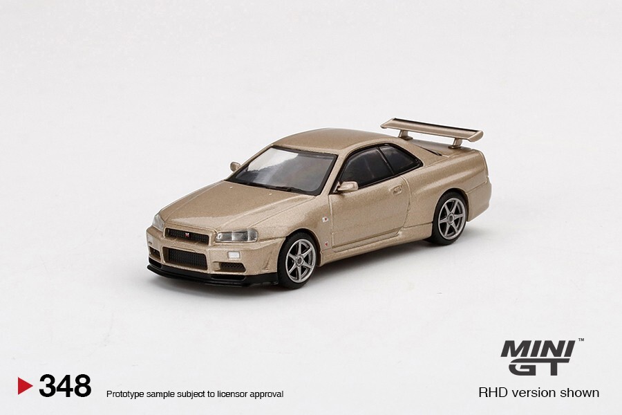 Mini GT 1:64 Nissan Skyline GT-R (R34) M-Spec Silica Breath Gold