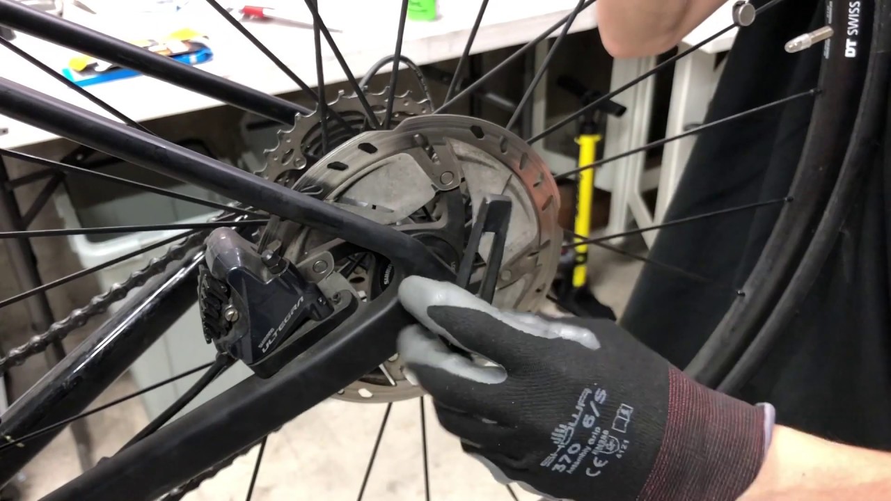 How to remove the rear wheel of a disc road bike - YouTube