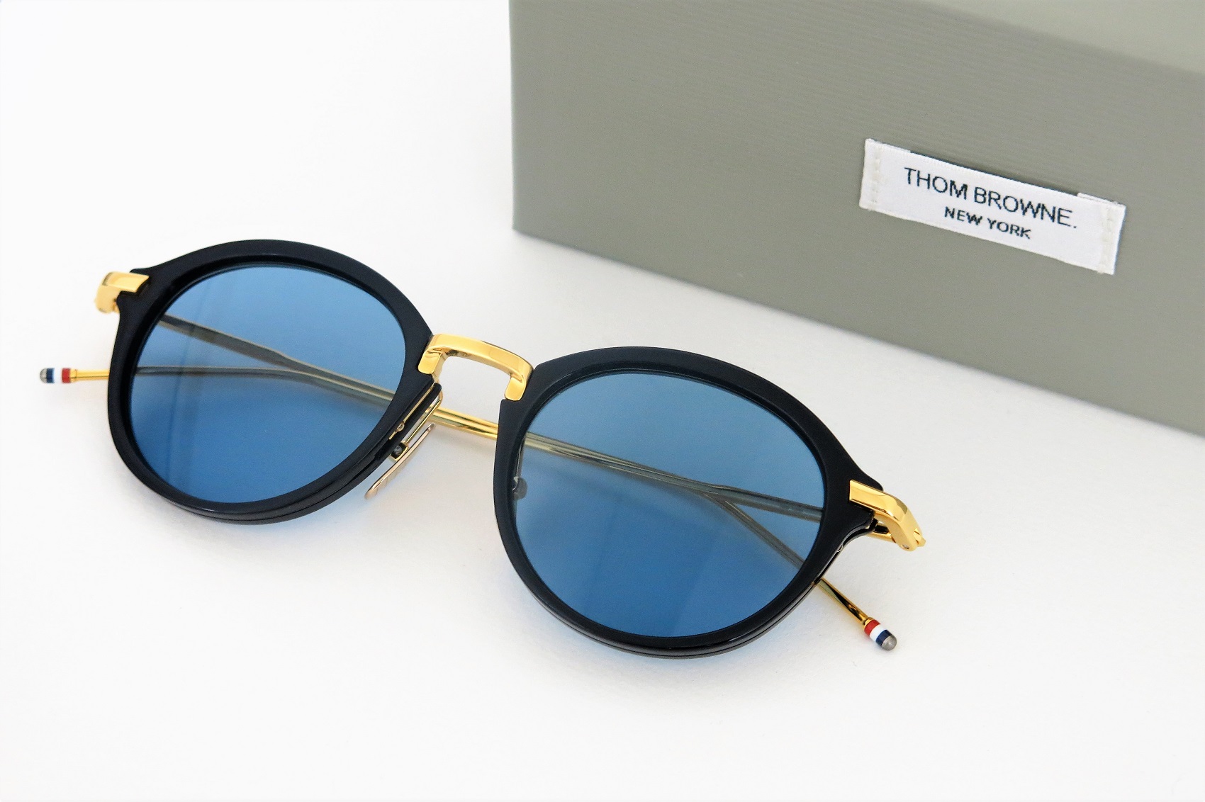 再入荷 / THOM BROWNE TB-011-F-T NAVY-GOLD SUNGLASS ポンメガネ大宮