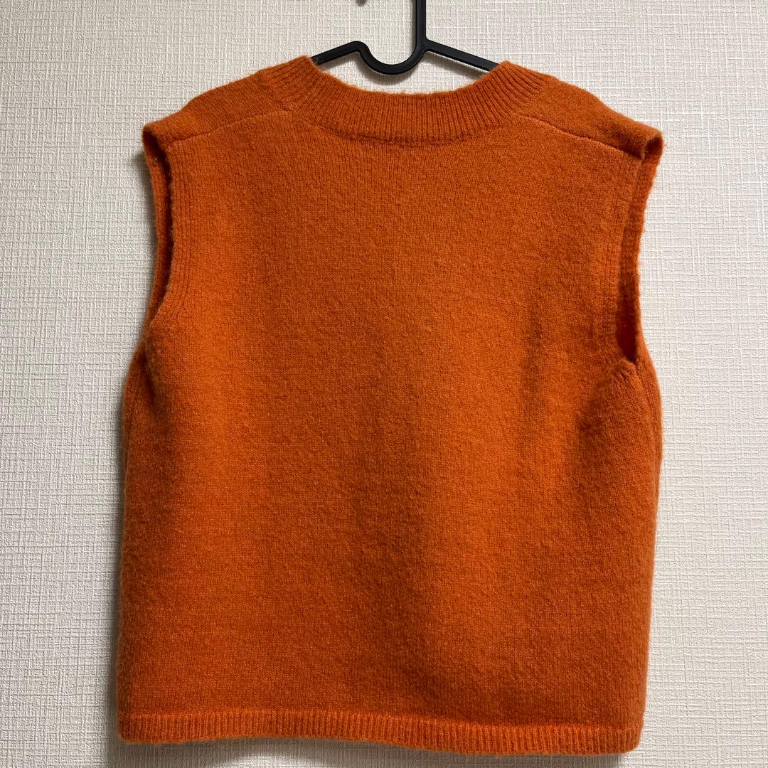 titivate オレンジニットベスト 春 - メルカリ
