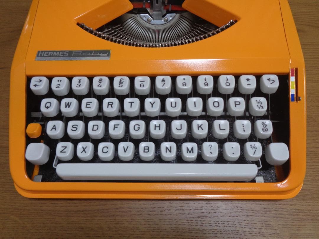 完働品HERMES Baby エルメスベイビータイプライターオレンジカラー