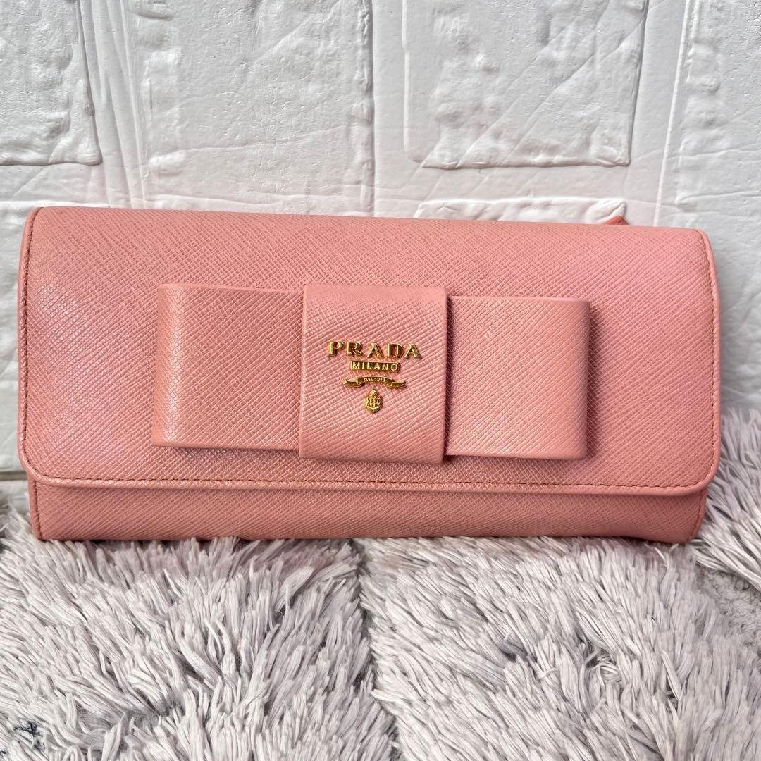 美品✨PRADA サフィアーノ　フィオッコ　リボン　メタルロゴ　長財布　ピンク 楽天市場】【新品】 プラダ 長財布 ジップアラウンドウォレット