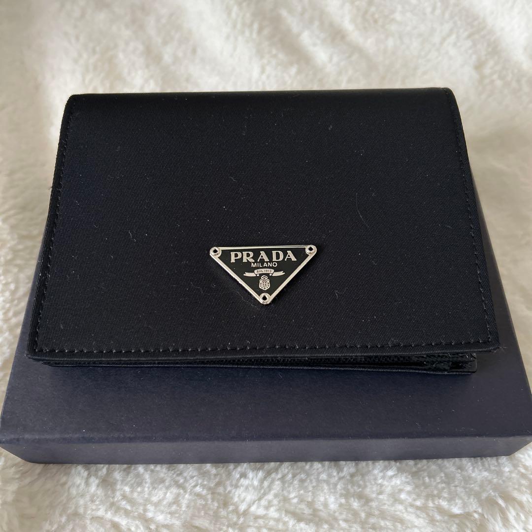 未使用品 PRADA 2つ折り財布 ナイロン 三角プレート - メルカリ