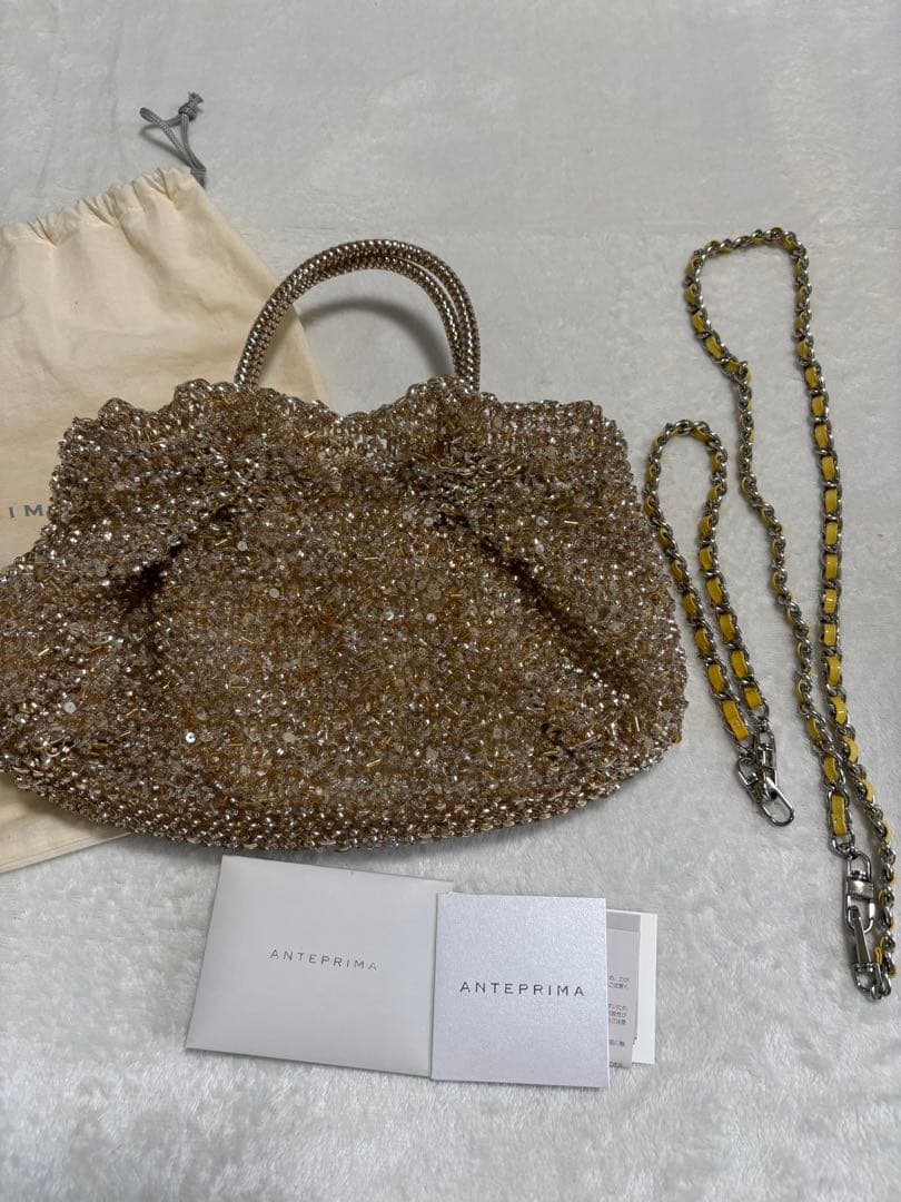 美品☆ANTERIMA ゴールド ビーズ パーティーバッグ保存袋付き - メルカリ