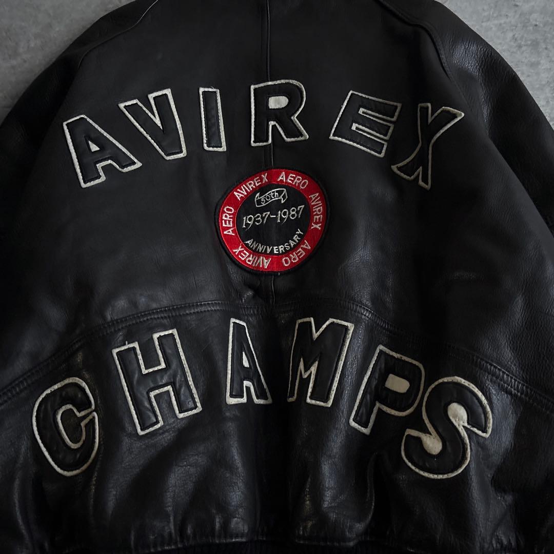AVIREX【XL】50周年記念モデル 本革 レザー スタジャン 黒 アーチロゴ