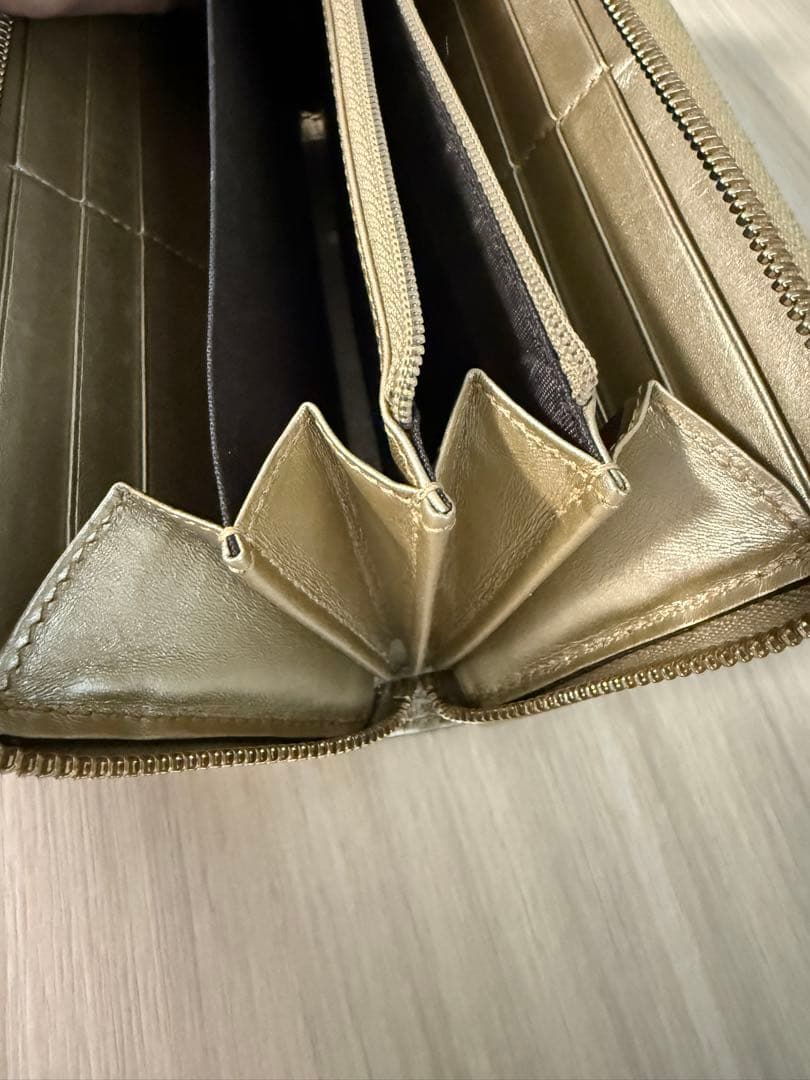 GUCCI ゴールド ロゴパターン リボン付き長財布