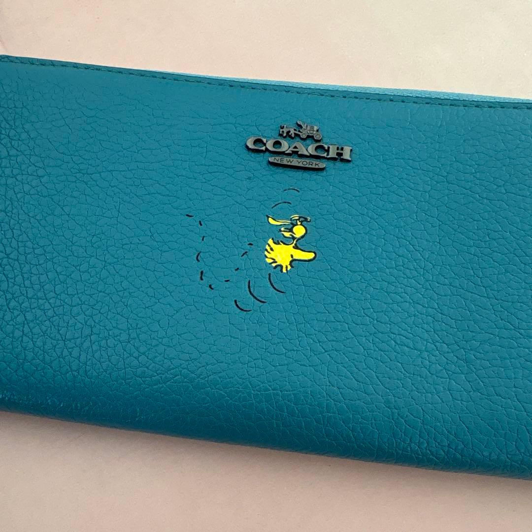 み*ん様 COACH 長財布 青 キャラクター付き ウッドストック PEANUT