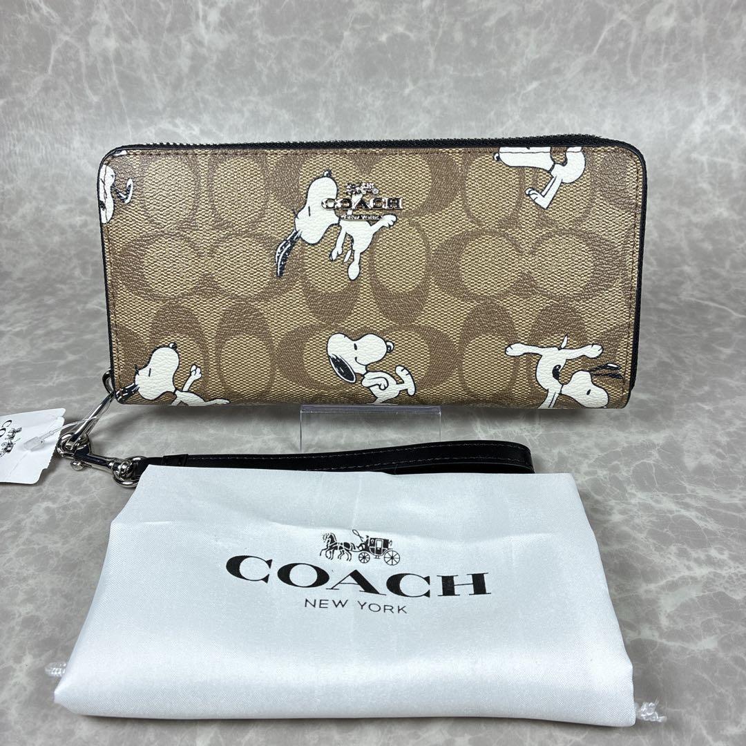 【未使用級】COACH×スヌーピー コラボ長財布 シグネチャー 保管袋付き COACH コーチ ピーナッツ スヌーピー コラボ 長財布 CBN35 新作 (Coach