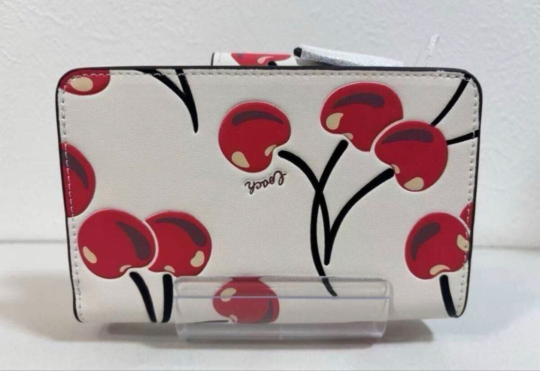 COACH チェリー柄 二つ折り財布 - メルカリ