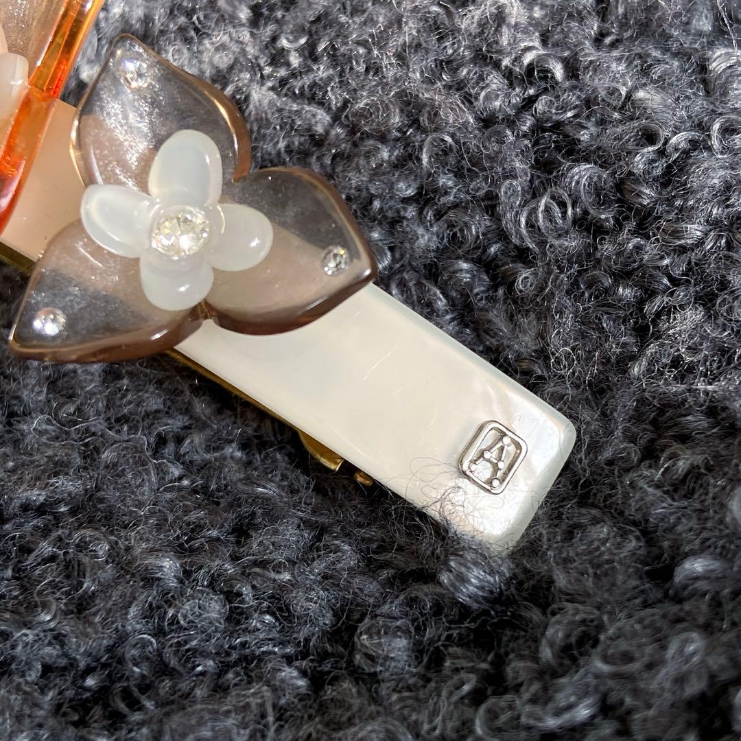 アレクサンドルドゥパリ フラワー バレッタオレンジ クリア 透明 夏